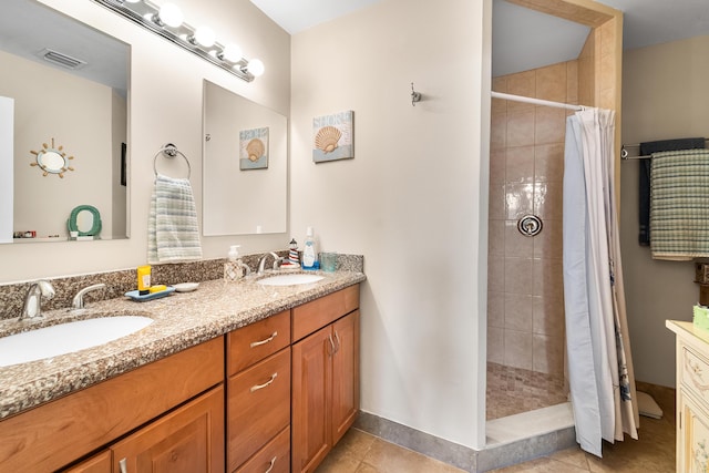 bathroom with tile patterned flooring, vanity, and a shower with shower curtain