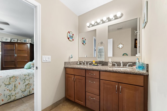 bathroom with vanity and tile patterned floors