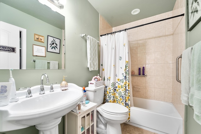 full bathroom with tile patterned flooring, shower / bath combo, sink, and toilet