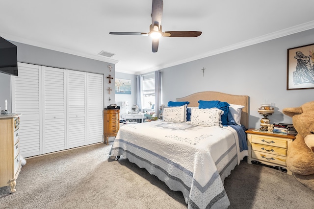 carpeted bedroom with crown molding, a closet, and ceiling fan