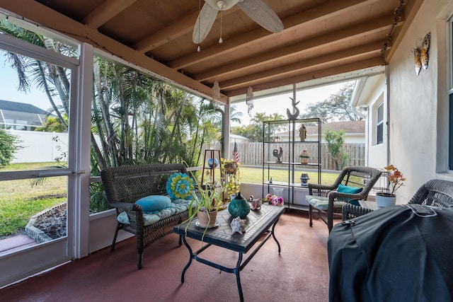 sunroom featuring ceiling fan