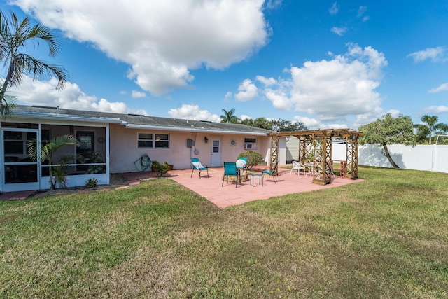 rear view of house with a patio, a sunroom, a yard, and a pergola