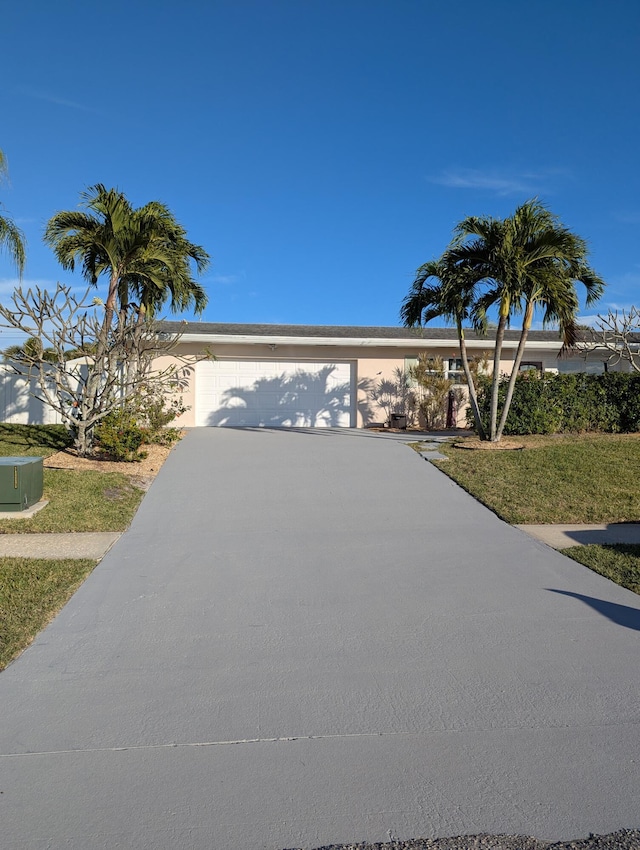 view of front of house featuring central AC unit and a garage