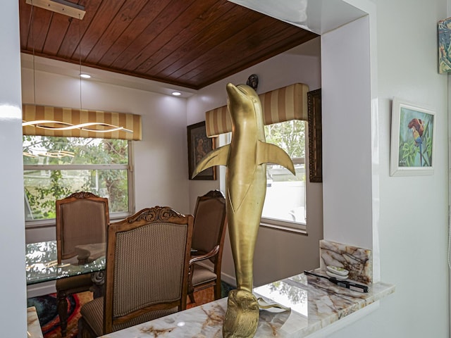 dining space with plenty of natural light and wooden ceiling