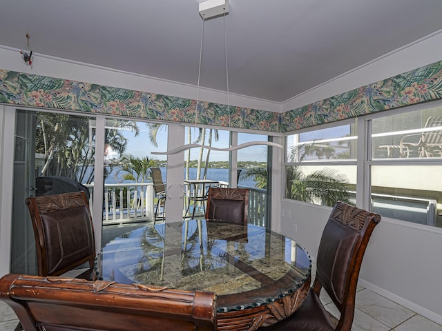 dining area featuring a water view