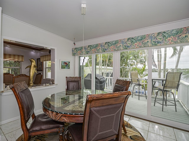 dining room with marble finish floor and vaulted ceiling