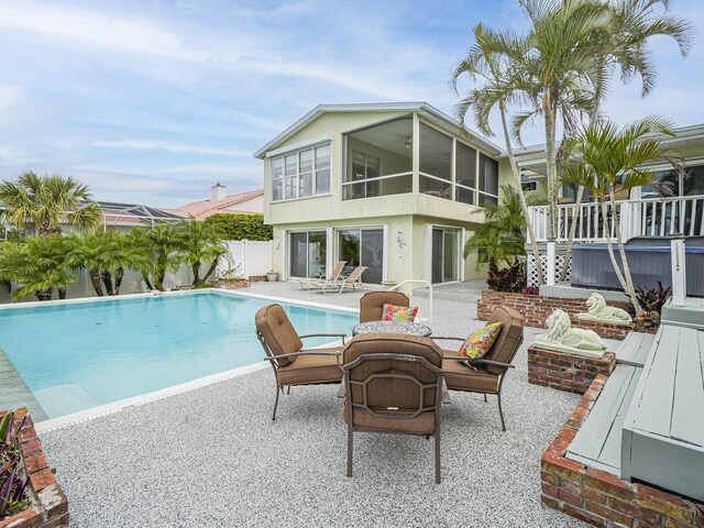 view of pool with a patio and a water view