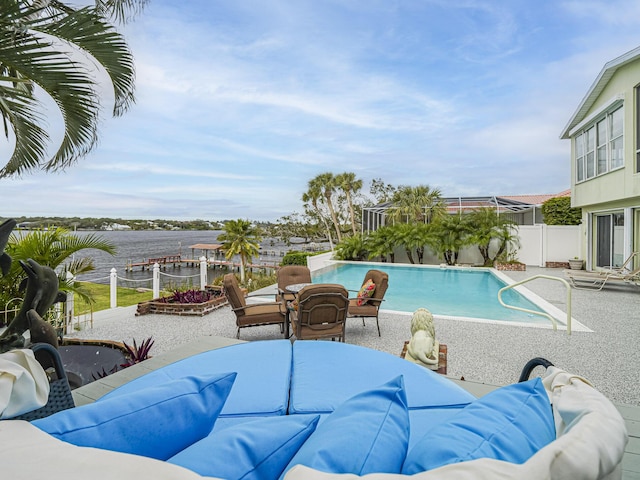 view of swimming pool featuring a fenced in pool, a patio area, fence, and an outdoor living space