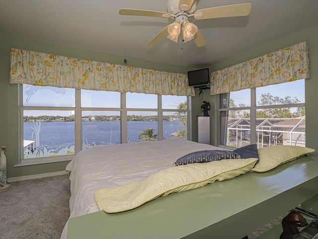 bedroom with carpet floors, ceiling fan, and baseboards