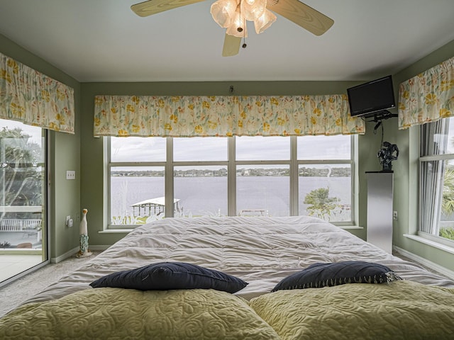 bedroom featuring ceiling fan, access to outside, carpet, and baseboards