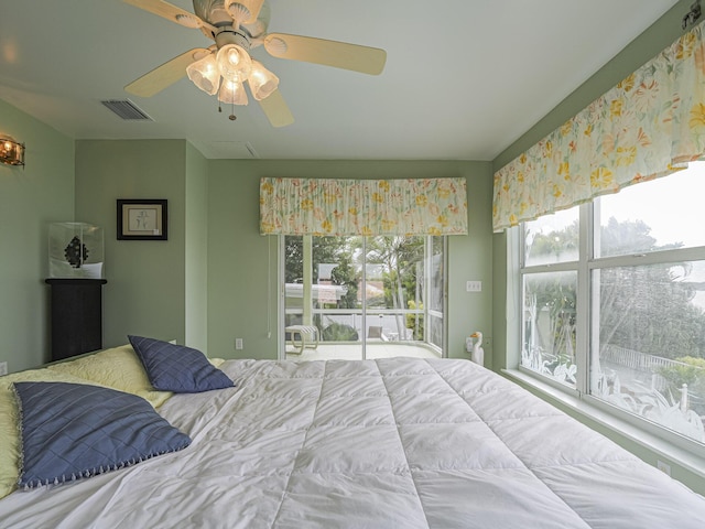 bedroom with visible vents and a ceiling fan