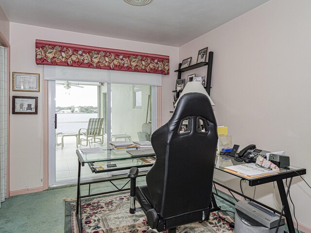 carpeted bedroom with beam ceiling and ceiling fan