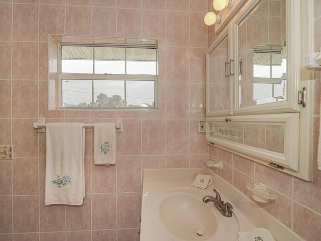 bathroom with tile walls and vanity