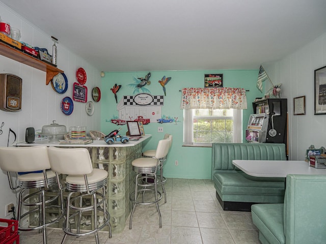 interior space featuring a kitchen breakfast bar