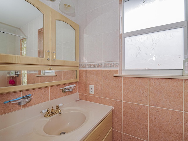 bathroom featuring tile walls, vanity, and decorative backsplash