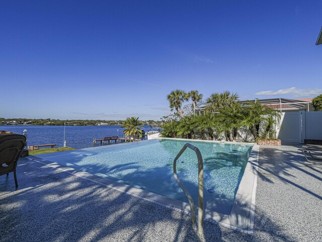 view of pool with a water view