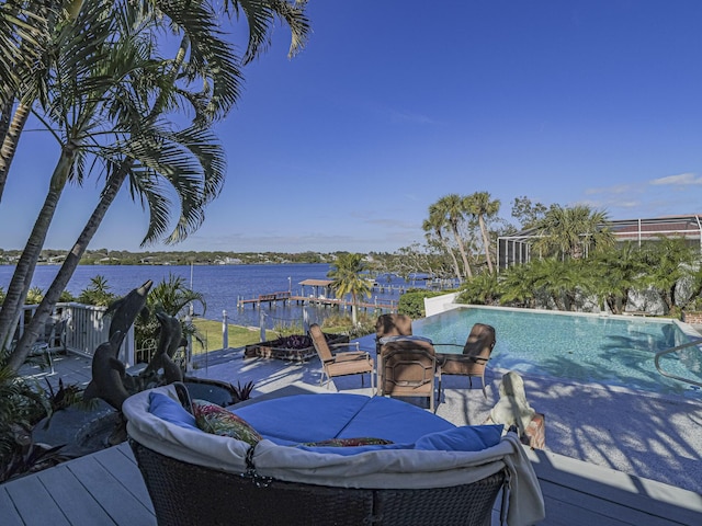 exterior space featuring a water view and an outdoor pool