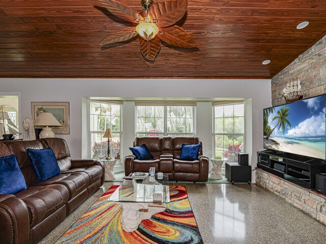 living room with ceiling fan, lofted ceiling, a fireplace, and wood ceiling