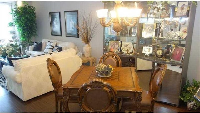 dining area featuring dark wood-type flooring