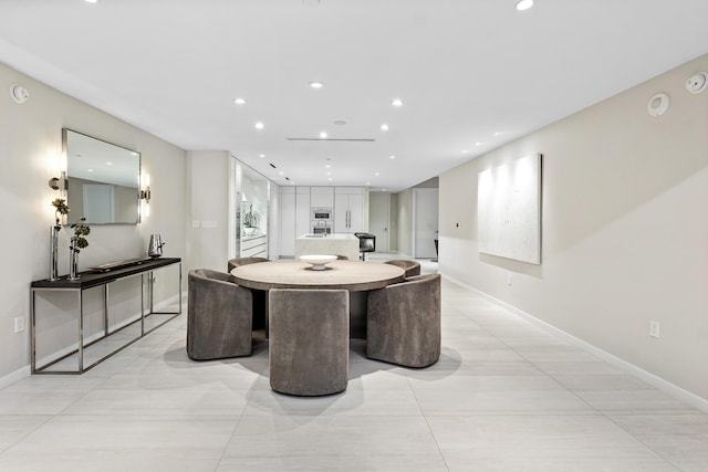 dining area featuring light tile patterned flooring