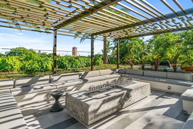 view of patio / terrace featuring a pergola and an outdoor living space with a fire pit