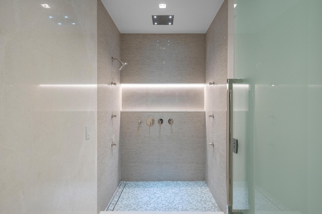 bathroom with tiled shower