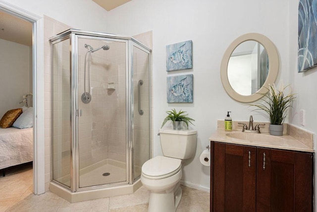 bathroom with toilet, a shower with shower door, tile patterned floors, and vanity