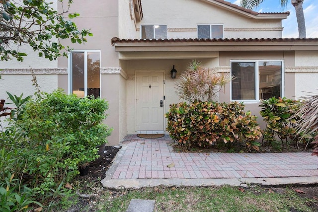 mediterranean / spanish-style home featuring a garage and a front yard