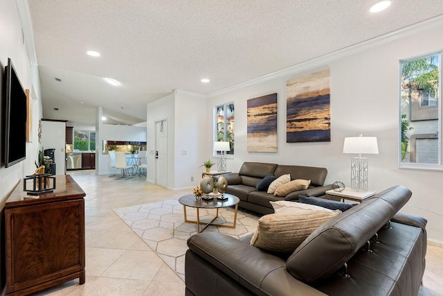 living room with ornamental molding, a textured ceiling, and light tile patterned flooring