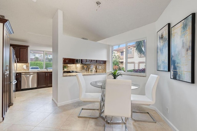 dining space with light tile patterned floors