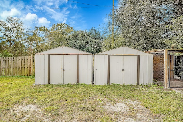 view of outbuilding featuring a lawn