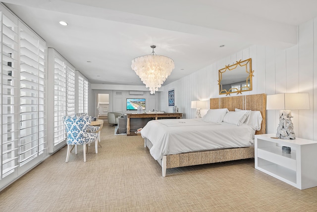 carpeted bedroom featuring a chandelier