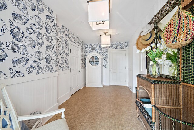 bedroom featuring an inviting chandelier and light carpet