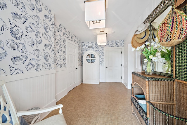 foyer entrance featuring a skylight