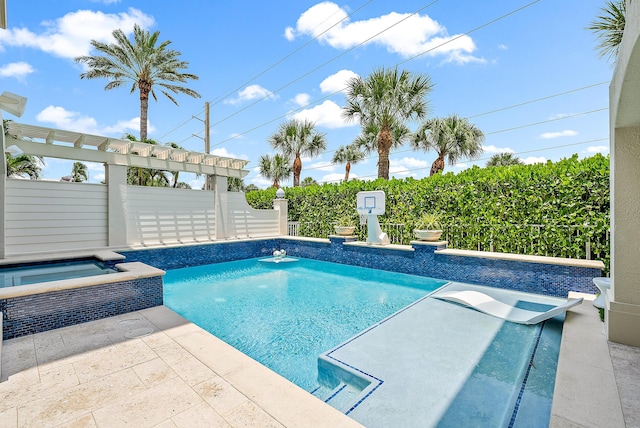 view of pool with an in ground hot tub