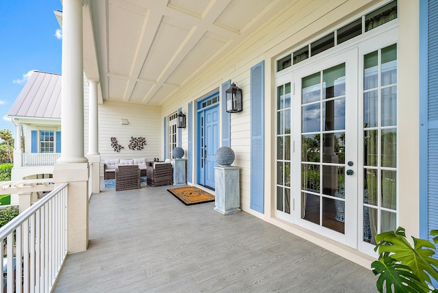 wooden terrace featuring covered porch