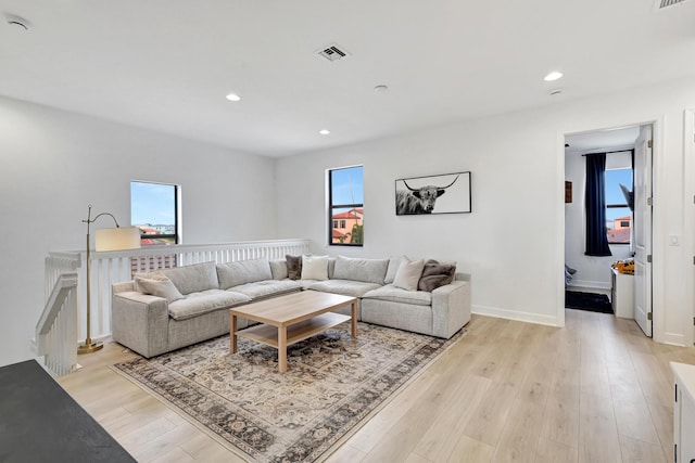 living room with light hardwood / wood-style floors