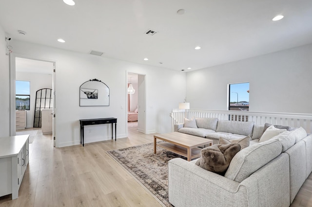 living room with light hardwood / wood-style floors