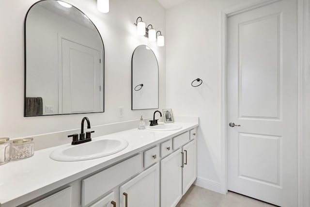 bathroom featuring tile patterned floors and vanity