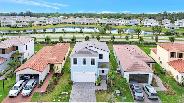 birds eye view of property featuring a water view