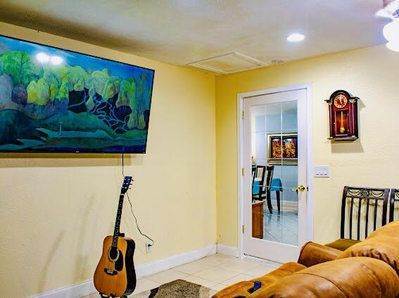 living room featuring light tile patterned floors