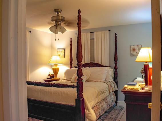 tiled bedroom with ceiling fan