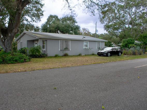 ranch-style house with a front lawn