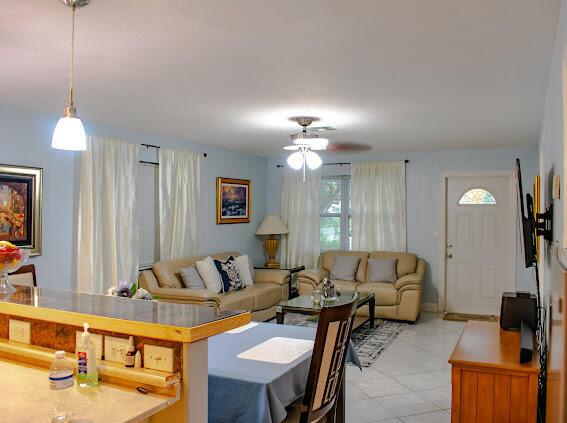 living room featuring ceiling fan