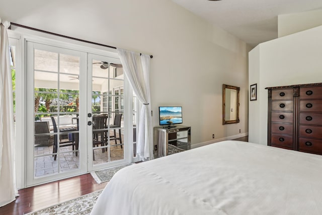 bedroom with access to exterior, dark hardwood / wood-style floors, and french doors