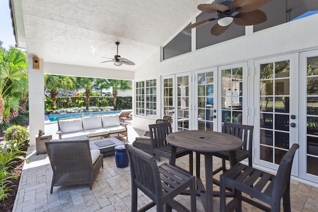 view of patio / terrace featuring french doors, ceiling fan, and an outdoor living space