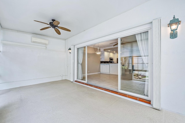 interior space featuring a wall unit AC and ceiling fan