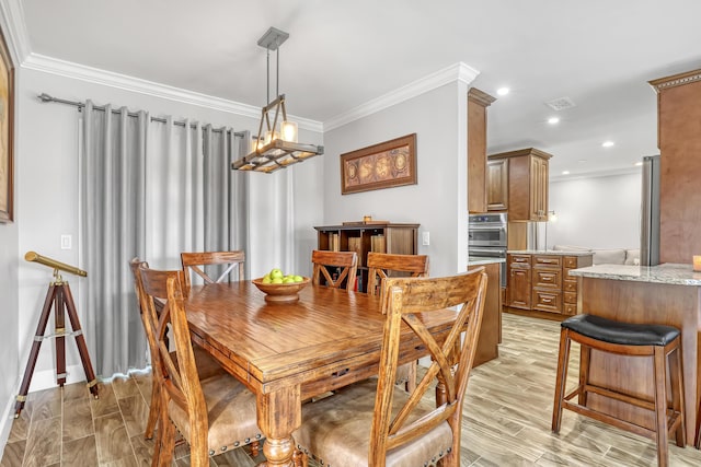 dining room with crown molding