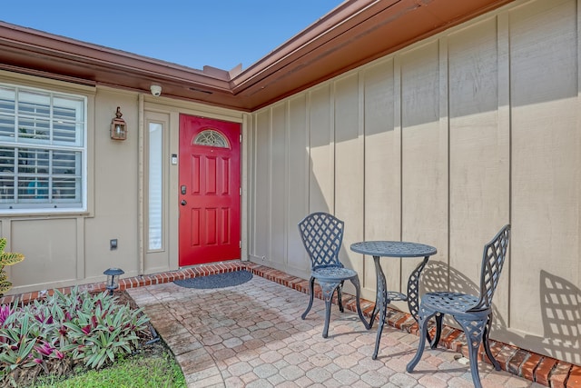 doorway to property with a patio area