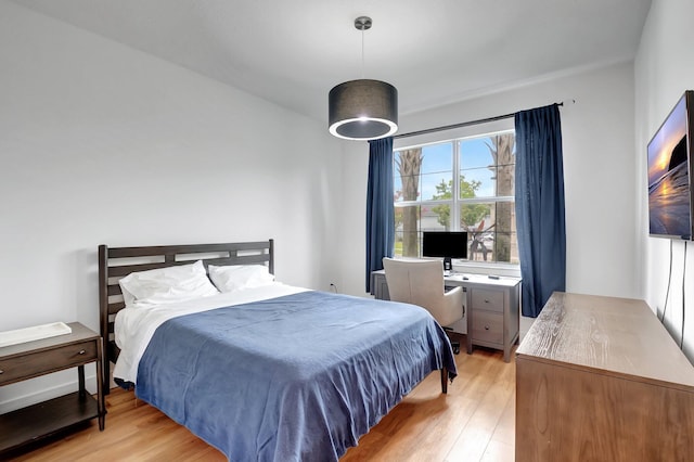 bedroom with light hardwood / wood-style floors